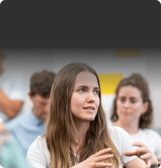 Participant explaining her view in a workshop with a hand gesture