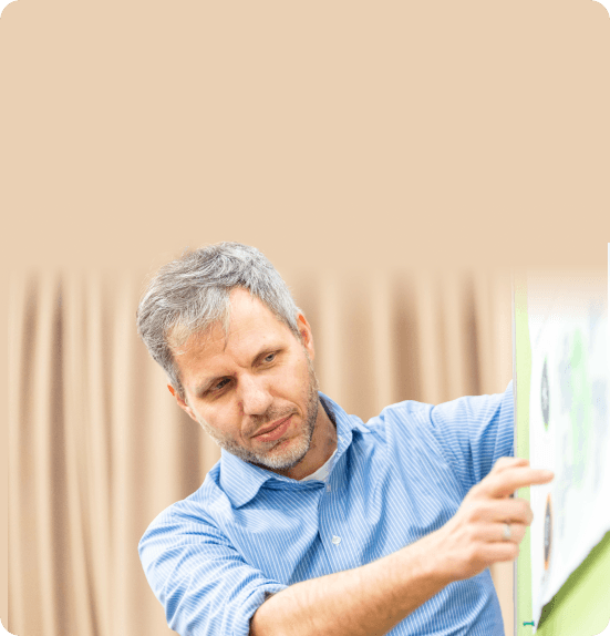 Consultant working with concentration at a pinboard