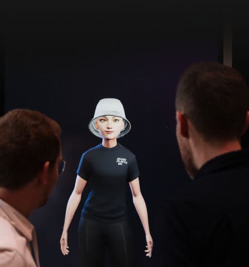Two men looking at a life-size hologram of an avatar figure