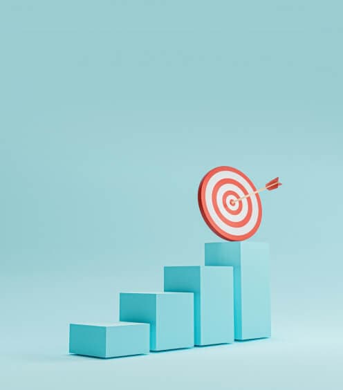 Rising steps with a target on the top one, an arrow in the bullseye